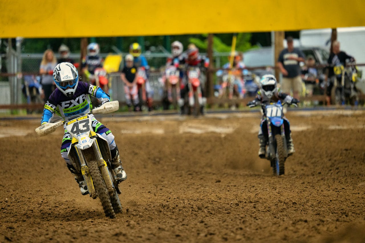 Intense motocross action at Millville, MN with riders racing on dirt bikes.